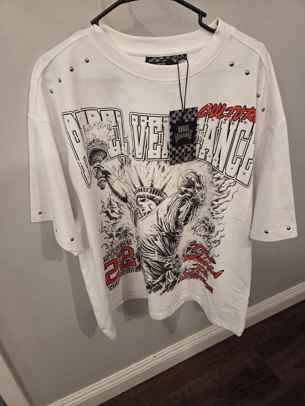 Oversized Rebel Vengeance Statue of Liberty graphic t-shirt features studded